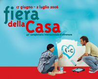 un uomo ed una donna che dipingono un cuore su un foglio bianco. è leggibile la scritta: 17 giugno-2 luglio 2006, fiera della casa